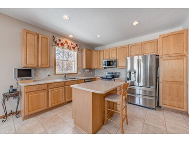 Bright eat-in kitchen with stainless steel applian