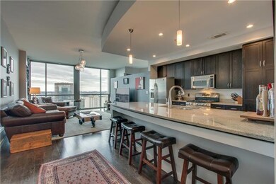 A few steps further in one can see the kitchen & family room & get a glimpse of the view.