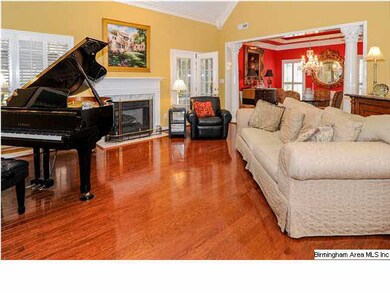 Vaulted ceiling and recessed lighting. Hardwood fl