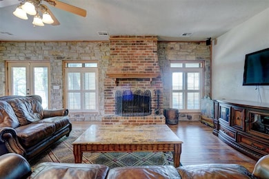 Living room featuring french doors, ornamental mol