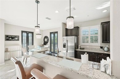 Kitchen featuring light tile patterned floors, a k