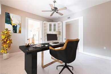 Office area featuring a ceiling fan and light tile patterned floors