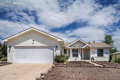 Ranch-style home with concrete driveway, a garage, covered porch, and roof with shingles