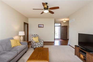 Continuous hardwood floors from front door to kitc