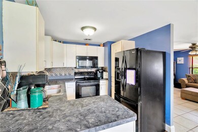 Kitchen with custom backsplash