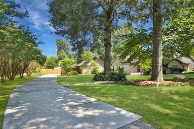 Long private drive accommodates many vehicles and has a two car garage and a two car carport.  Your guests will love parking off the street.  Plus, there is room on the side to park an RV or park it in your shed.  Perhaps you can park boat...