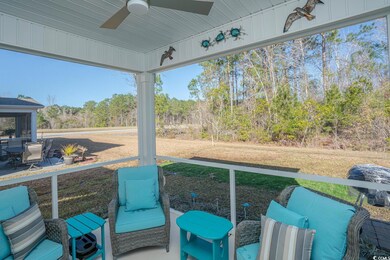 Sunroom / solarium with a ceiling fan