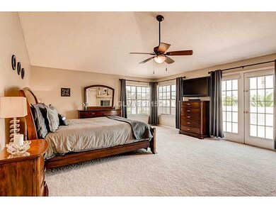Property Photo. Master Bedroom with ceiling fan.