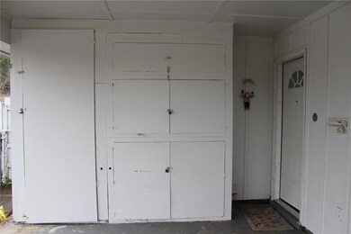 CARPORT: Tons of built-in storage under carport