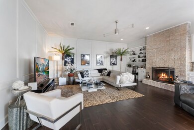 The beautiful living room offers built in storage,