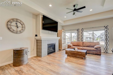 Living area featuring wood finished floors, basebo
