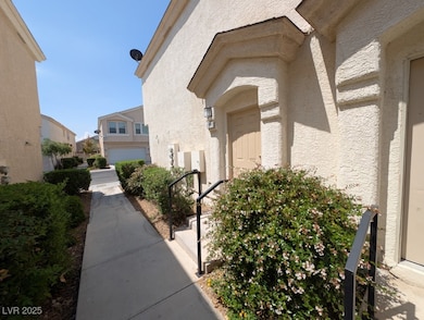 View of exterior entry featuring stucco siding and
