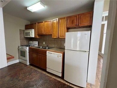 Kitchen with dishwasher and gas stove