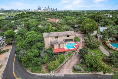 Bird's eye view of city skyline and a pool