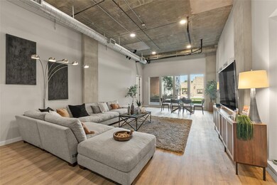 Living room featuring a high ceiling and wood fin