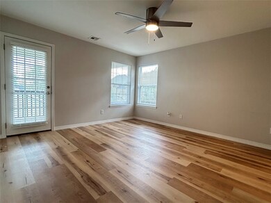 Primary bedroom has door to back deck.
