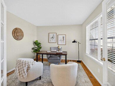 Main floor office with glass double french doors.