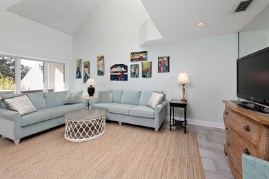 Large living room/great room with skylights and a