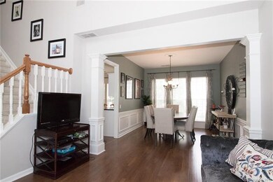 Warm, 5 inch wood floors are throughout the main l
