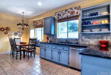 Spacious and sunny kitchen features tile flooring 