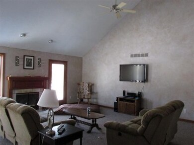 Living room with fireplace also access to deck area.