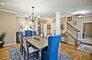 Dining area looking toward the hall to the living room. The office is through the door to the right past the staircase.