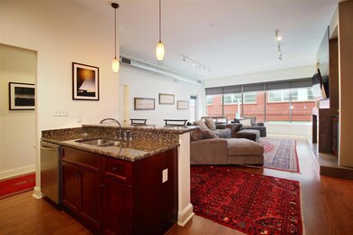 The kitchen has a large breakfast bar and is open 