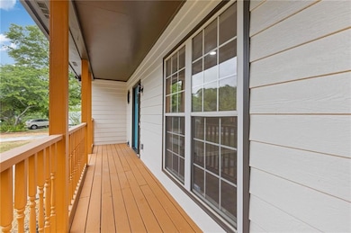 Balcony featuring covered porch
