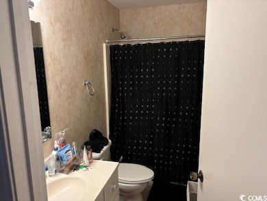 Full bathroom with vanity and a shower with curtain