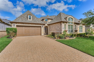 Double wide paved driveway leads into a 3 car tandem garage. 3rd bay has Aircon