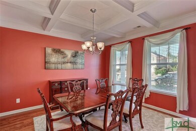 Formal Dining Room with coffer ceilings.