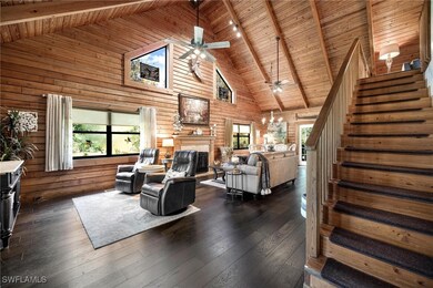 Living room with high vaulted ceiling, plenty of n