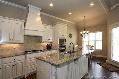 Hardwoods throughout the entry, family, kitchen, a