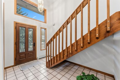 Spacious entry with great space for a boot bench, hooks, and two closets for storage.  Enter from the garage here too.