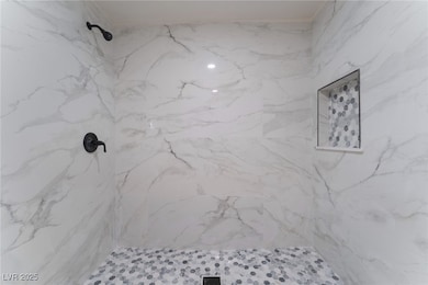 Full bathroom featuring a marble finish shower