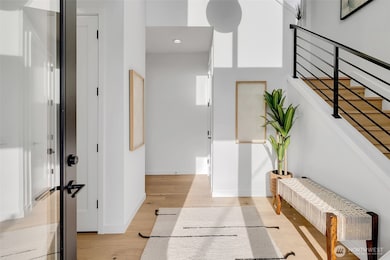 Spacious entry way with coat closet.
