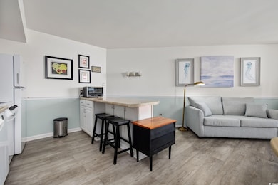 Living area with light wood finished floors