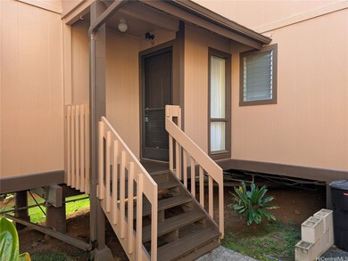 View of entry door from carport