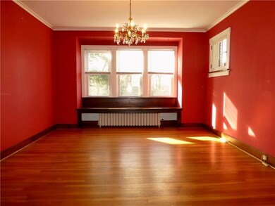 15x13 Dining room has hardwood floors, crown moldi