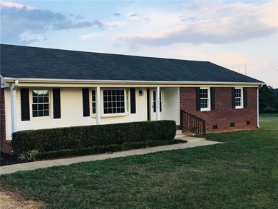 Nice front porch and concrete walkway.