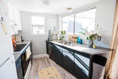 Kitchen featuring light wood-style floors, a sink