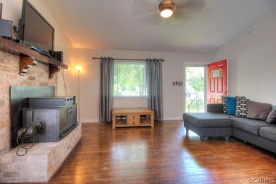 Brick Fireplace with wood insert keeps the house w