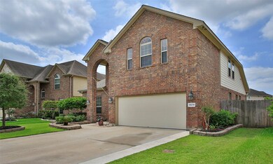This home has beautiful landscaping with front and back sprinklers.  Notice the driveway has been extend two feet on both sides with decorative stones.