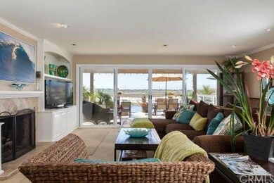 Living area with sliding doors, and fireplace.