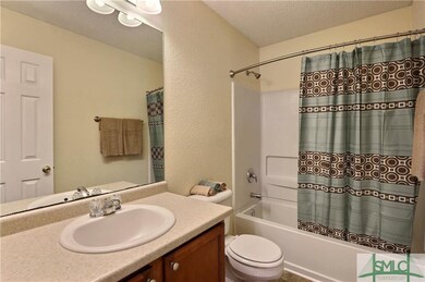 Shared bathroom for two adjoining bathrooms with u