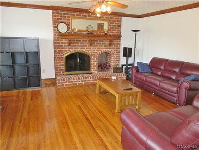Family Room also boasts a brick fireplace with gas