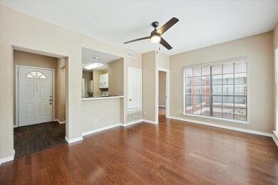 Unfurnished living room featuring wood finished f