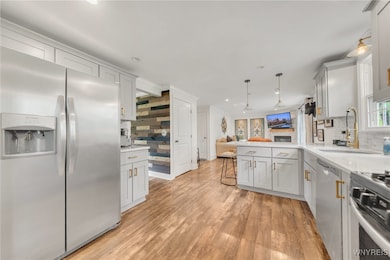 Kitchen, Living Rm to left, newer cabinets, light