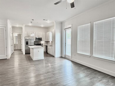 Large living room with faux wood floors