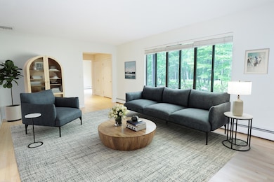 Living room is off the dining room and opens to front entry